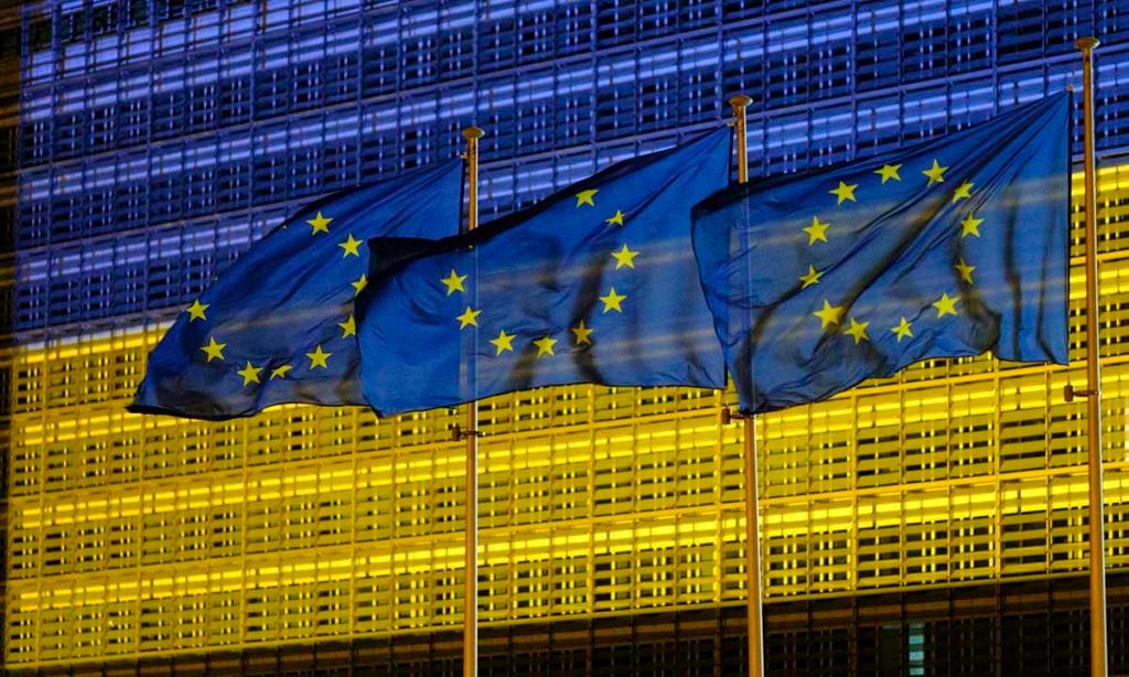 BRUSSELS, BELGIUM - MAY 8: The Berlaymont, the EU Commission headquarter is lighted in Blue and Yellow, the colors of the Ukrainan Flag on May 8, 2022, in Brussels, Belgium. According to American intelligence, May 9 marks a deadline for the Russian president, Vladimir Putin who intends to declare a victory or significant progress on the Ukrainian front. (Photo by Thierry Monasse/Getty Images)
